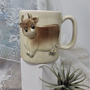 Coffee mug in Embossed cow design, Otagiri 1981